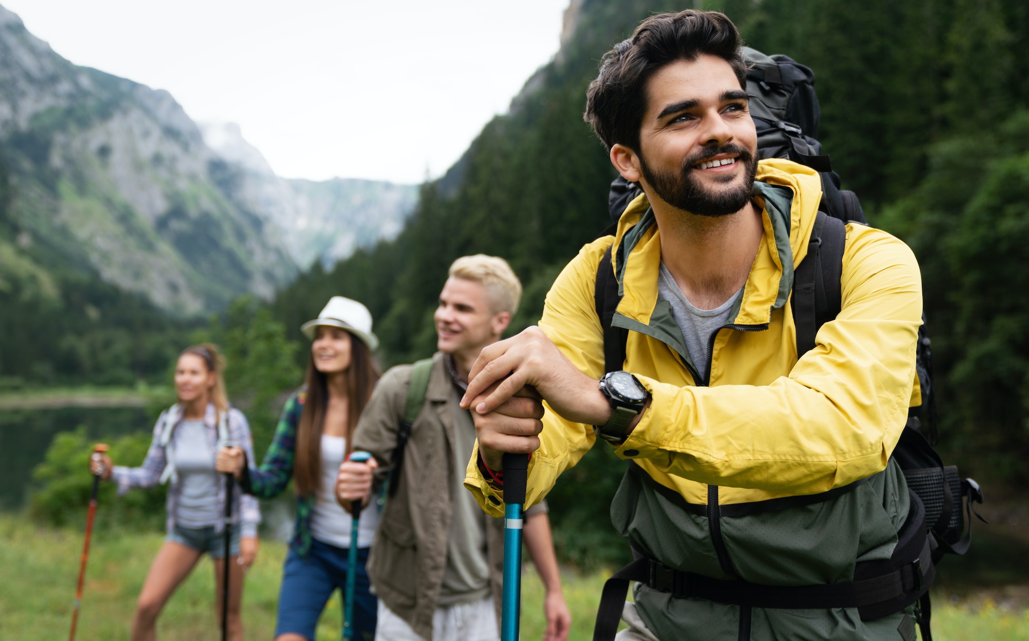 Group of friends on a hiking, camping trip in the mountains